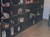 a room with a lot of books on the shelves