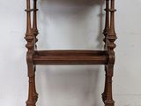 an old wooden shelf with a drawer on top of it