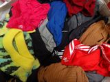 a pile of clothes that is sitting in a suitcase