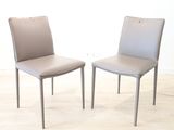 two chairs sitting next to each other on a hard wood floor