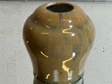 a small vase that is sitting on a glass table