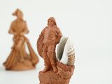 three figurines that are sitting next to each other
