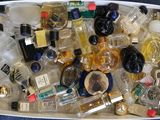 a white box filled with lots of different types of perfumes