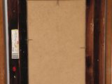an old wooden easel with a painting on the top of it