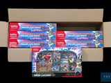 a lot of pokemon cards in a cardboard box