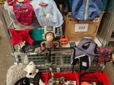 a cart full of stuffed animals and other items