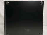 a close up of a black metal box on a white background