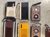 many different types of old radio on the floor