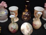 many vases that are sitting on a black table