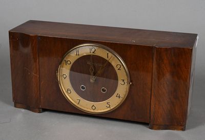 a wooden clock that is sitting on a table
