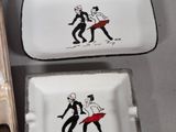 two trays with different designs on them sitting on a table