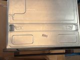 a laptop computer sitting on top of a cardboard box