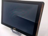 a tablet computer sitting on top of a stand