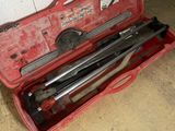 a tool case with tools in it on the floor