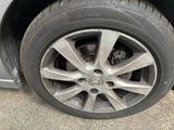 a close up of a tire on a car ' s rim