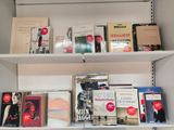 many books on the shelves in the room