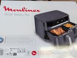 the box is open to show the inside of an air fryer