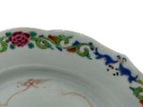 a white plate with a colorful floral design on it