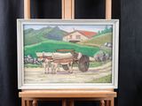 a picture of a painting of a farm scene on a easel