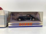 a box with a toy car inside of it on a white surface