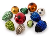 many different colored christmas ornaments arranged together on a white surface