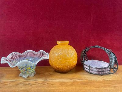 three glass vases sitting on a table next to each other
