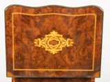 a wooden chair with a gold decoration on the back
