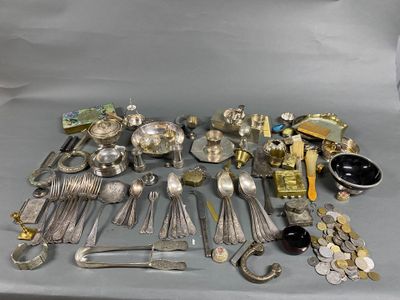 a lot of silverware and other silverware on a table
