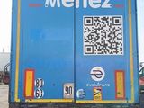a blue truck with a qr code on the back of it