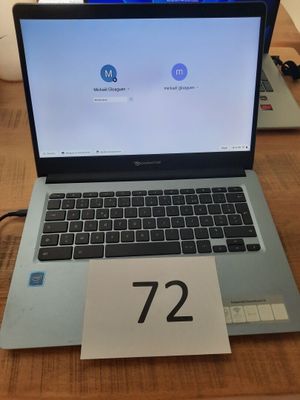 a laptop that is sitting on a table with a price tag on it