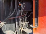 a close up of a train engine with wires attached to it