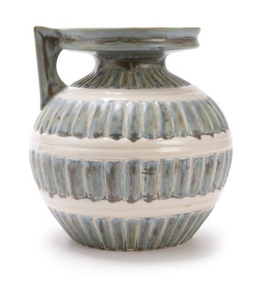 a blue and white vase with a handle on a white background