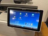 a tablet that is sitting on top of a printer