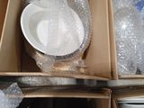 a box full of empty dishes and cups in it