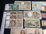 a lot of different bank notes on the table