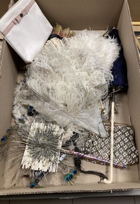 a cardboard box with a bunch of items inside of it