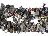 a pile of assorted watches on a white surface