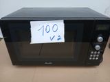 un micro-ondes noir sur lequel est collée une note