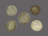 a group of five silver coins