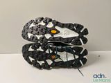 the soles of a pair of running shoes on a white surface