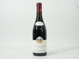 a bottle of wine that is sitting on a table