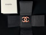 a black and white box with a chanel logo on it