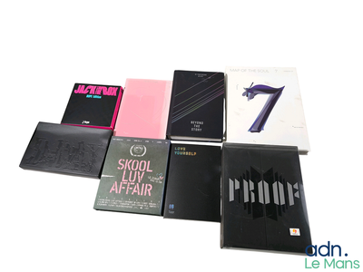 a lot of books that are sitting on a table