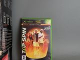 the xbox game is sitting on the table next to the box