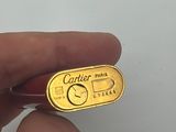 someone is holding a gold plated ring with a name on it