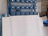 a cardboard box sitting on top of a carton in a warehouse