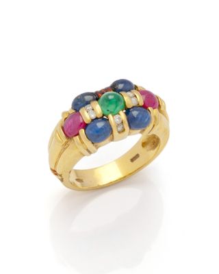 a gold ring with multi colored stones on a white background