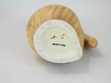 porcelain figurine of a snail with a white body and a brown body
