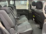 the back seats of a car are empty in a parking lot