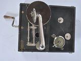 a black box with a silver handle and a metal lever